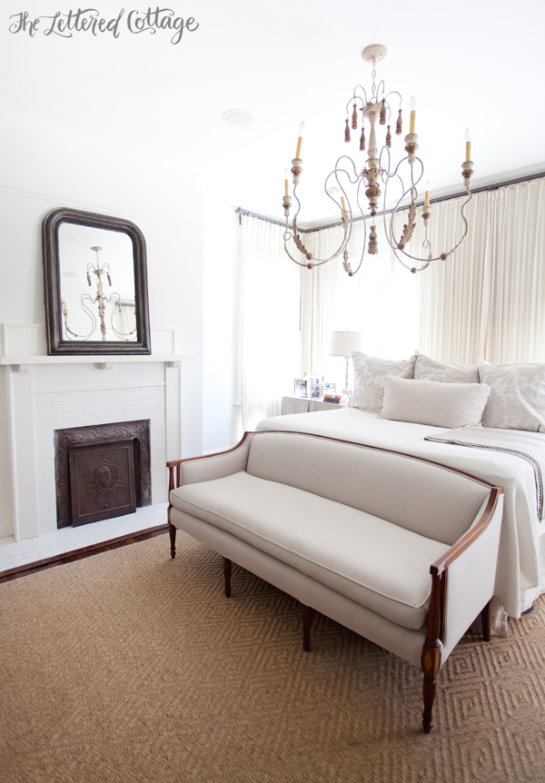 Master-Bedroom-White-and-Neutrals-Fireplace-Chandelier-Loveseat